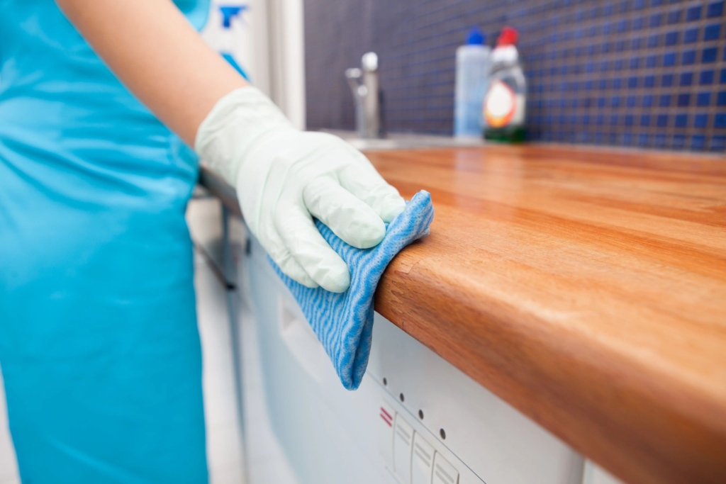 hand cleaning a counter
